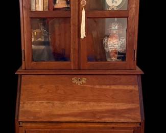 vintage Queen Anne-style slant-front secretary desk with a glass-front bookcase hutch