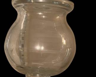 hand-blown clear glass apothecary or candy jar featuring a decorative bird figurine on the lid and a footed pedestal base