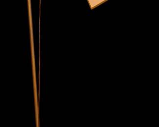 an antique or vintage cast iron bridge arm floor lamp, likely from the 1920s Art Deco or Art Nouveau era, featuring an ornate, scroll-decorated upper section and heavy base