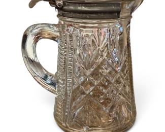 vintage pressed glass syrup pitcher with a hinged metal Lid