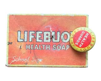 This is a vintage Lifebuoy Health Soap box in school size with a promotional "League of Health Guards" pin from Lever Brothers. Vintage packaging from the mid-20th century (approx. 1930s–1940s), often used in school hygiene campaigns.