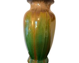 mid-century style ceramic vase featuring a green and brown vertical drip glaze