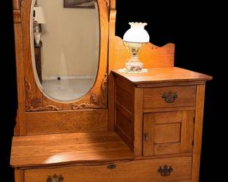 This is an antique Victorian or Edwardian-era oak hat box dresser, often referred to as a gentleman's dresser or bi-level dresser with a swivel mirror, dating from the late 19th to early 20th century.