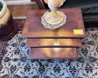 set of nesting tables. Can also see base of one of the two alabaster lamps