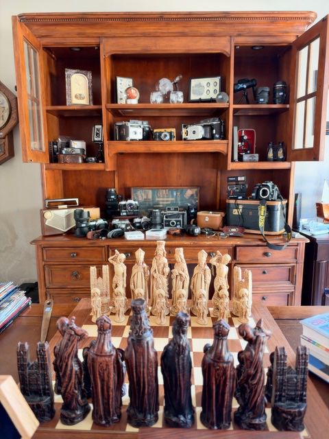 Medieval figural chess set, desk hutch with vintage camera collection