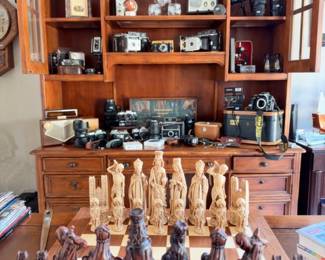 Medieval figural chess set, desk hutch with vintage camera collection
