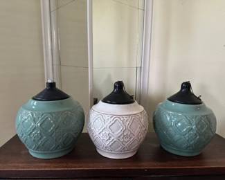 Set of three ceramic ginger jars with lids in teal and cream