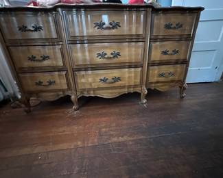 French Provincial serpentine dresser with ornate brass hardware and cabriole legs