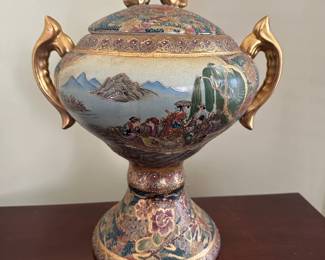 Vintage hand-painted decorative urn with gold leaf handles and scenic landscape detail