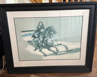 This framed artwork is a limited edition lithograph titled "Le cavalier sur la piste" (translated as "The rider on the track") by the French artist Claude Weisbuch (1927–2014), who was known for his expressive etchings and lithographs.  The lower-left corner shows E.A. / XXX. E.A. stands for Épreuve d'Artiste (Artist’s Proof). These are highly desirable impressions printed outside the main numbered run of 125, intended for the artist's personal use or distribution, giving it a slight collector's edge.