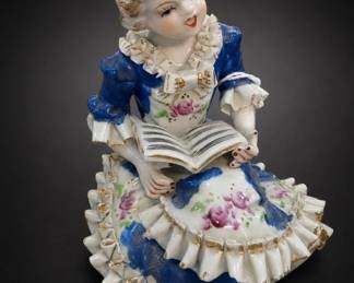 Seated Child Figurine With Open Book
