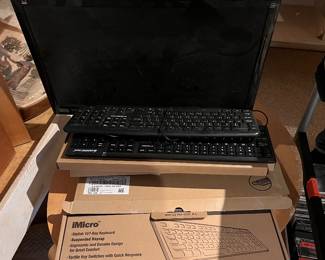 Computer monitor and about five keyboards