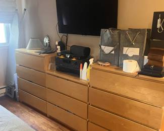 Vintage light wood dressers, packed with clothes