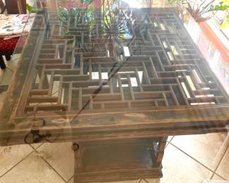 Carved lattice top dining table with glass top