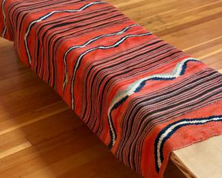 This lot features a stunning hand-woven Diné Navajo rug circa 1890-1900. Measures 63” x 51” and comes with fair market appraisal/condition report provided in photos.