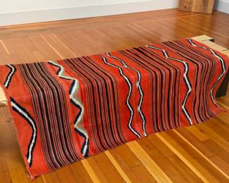 This lot features a stunning hand-woven Diné Navajo rug circa 1890-1900. Measures 63” x 51” and comes with fair market appraisal/condition report provided in photos.