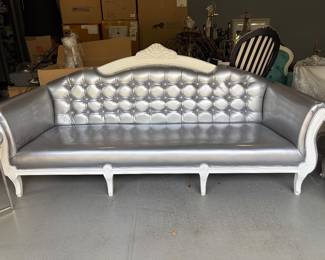 silver patent tufted sofa with white frame