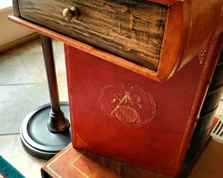 Just one of several cute end tables with lots of personality. This one in particular looks like old books.