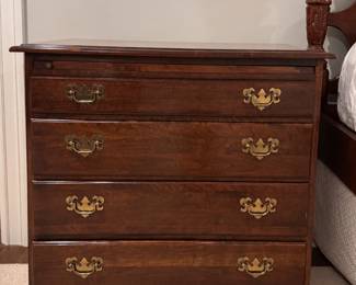 Four drawer nightstand with shelf