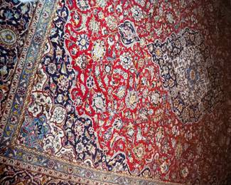 Handwoven wool Persian Keshan carpet. Reds with navy medallion and border. 10 X 14'2"