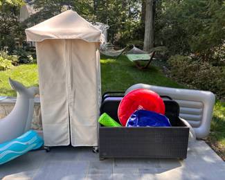 A pool cabana and inflatable pool toys
