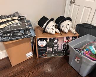 Many Halloween decorations including many costumes 