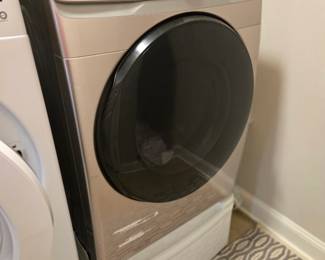 Samsung frontload Dryer with white storage pedestal 