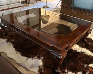 Traditional coffee table with inset beveled glass top and cabriole legs