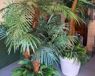 LOTS of impressive 6’ to 8’ faux palm trees and plants in decorative planters
