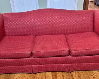 Large red rolled arm couch
