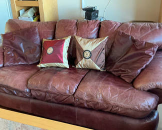 Lot 17: Burgundy ‘Leather’ Couch