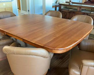 Lot 12: Solid Wood Pedestal Table, 6 ‘leather’ Rolling Barrel Chairs