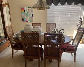 Table, 6 cane chairs, 2 leaves and custom table pad