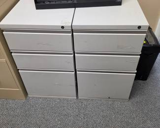Two matching light gray filing cabinets