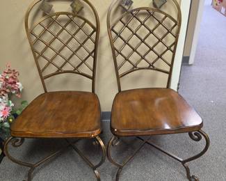 Two metal frame, wood seat dining or accent chairs with various stone accents on headrest