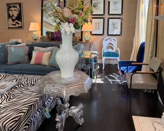 Moroccan table, Chinese vase, zebra oppomans