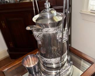 Antique silverplate tilting water pitcher