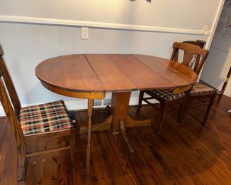 Antique oak table and chairs (support leg was added by owner to help him stand, can be easily removed)