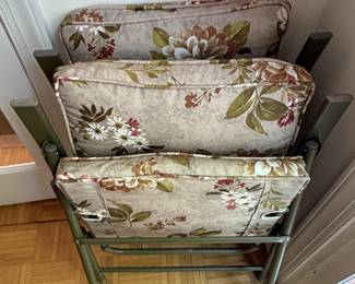 Set of floral patio furniture cushions with folding frames