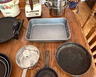 Cast iron skillets, stainless roasting pan, steamer pot and stovetop percolator