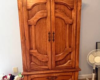 Oak armoire wardrobe cabinet with arched top and lower drawers