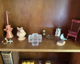 Shelf display with angel candleholder, glass cross, bird figurines and miniature rocking chair