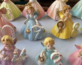 Collection of vintage ceramic birthday angel figurines with numbers