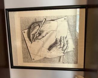 Framed M.C. Escher Drawing Hands print in black frame