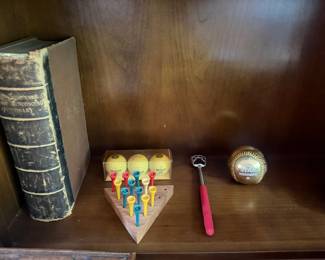 Antique leather bound dictionary, wood triangle peg game and commemorative baseball