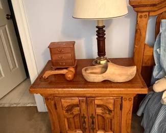 Oak nightstand with table lamp, wood shoe lasts and small wood box