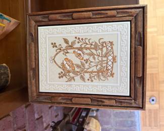 Framed crewel embroidery of birds and floral vine in carved wood frame