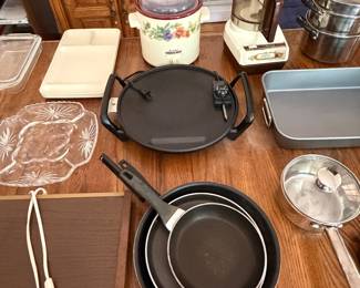 Cookware lot with nonstick skillets, griddle, stockpot, cutting boards and floral crock
