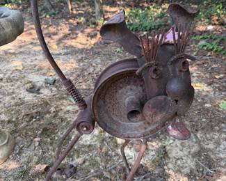 Rusted metal garden yard art sculpture