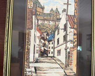 Framed European village street scene print in gold frame